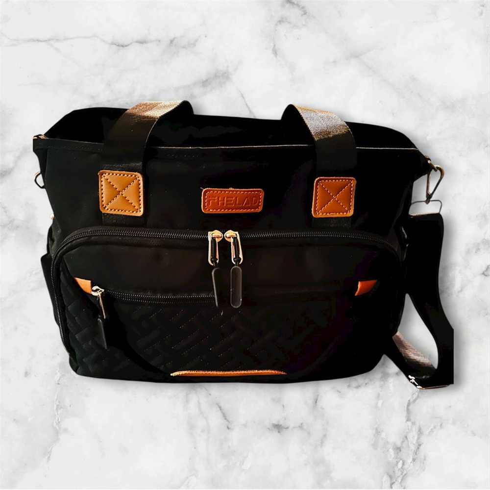 Black and tan leather with silver interior diaper bag